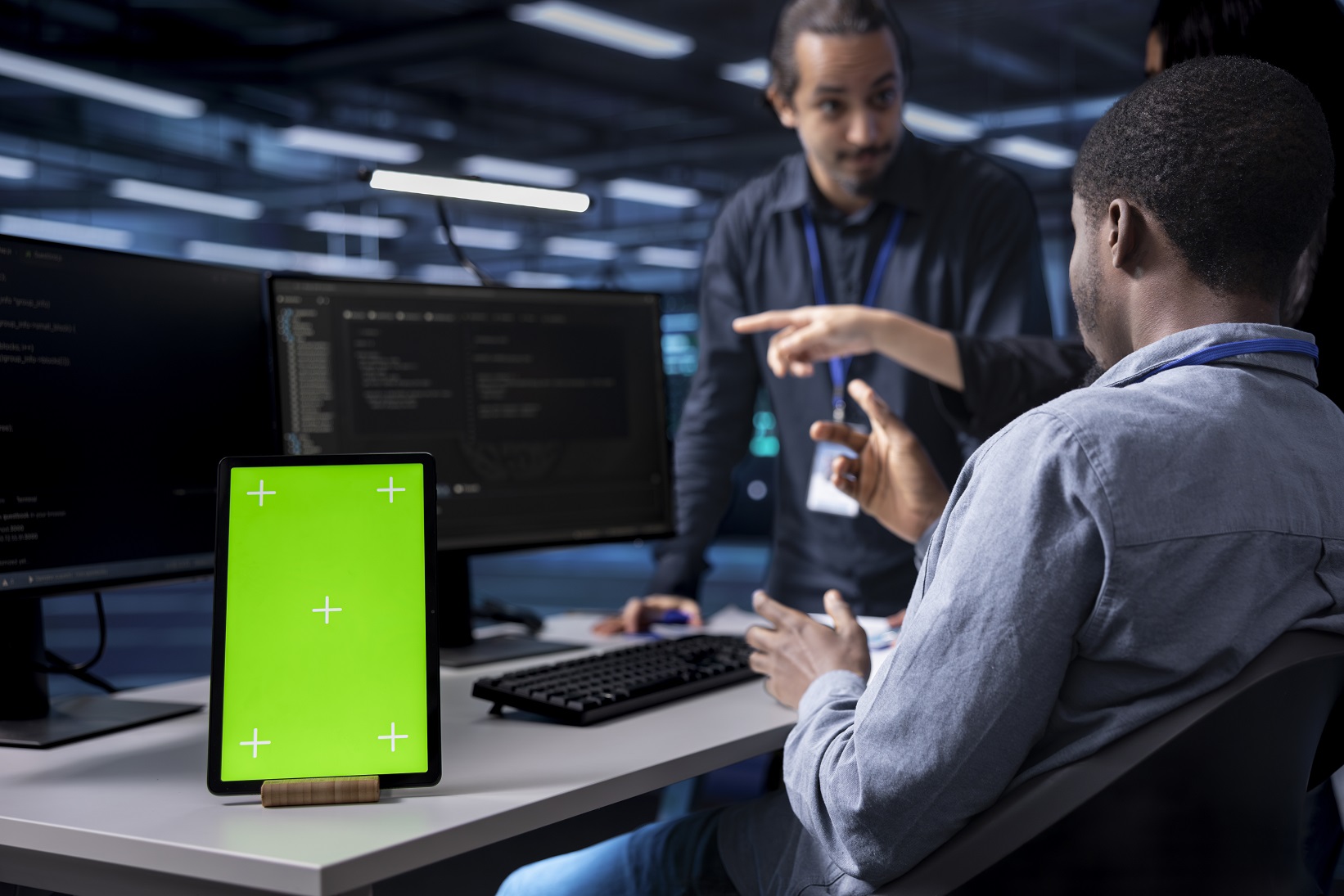 multiethnic team using green screen tablet to over mvkf9j9.jpg